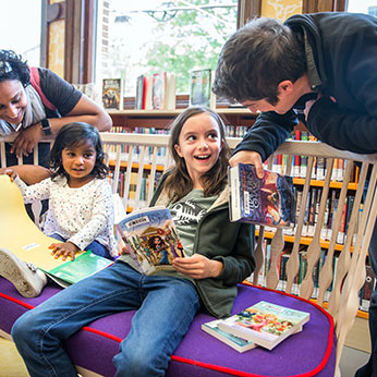 Kids and adults with books. Links to Beneficiary Designations Kids and adults with books. Links to Beneficiary Designations