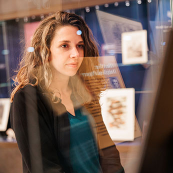 A woman looking at a display. Links to Donor-Advised Funds A woman looking at a display. Links to Donor-Advised Funds