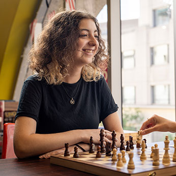 A woman playing chess. Links to Donor-Advised Funds A woman playing chess. Links to Donor-Advised Funds